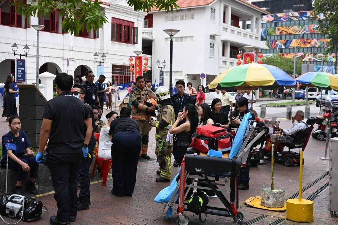 People have been evacuated from the premises and were sitting near the Stamford Arts Centre on Waterloo Street on March 13..