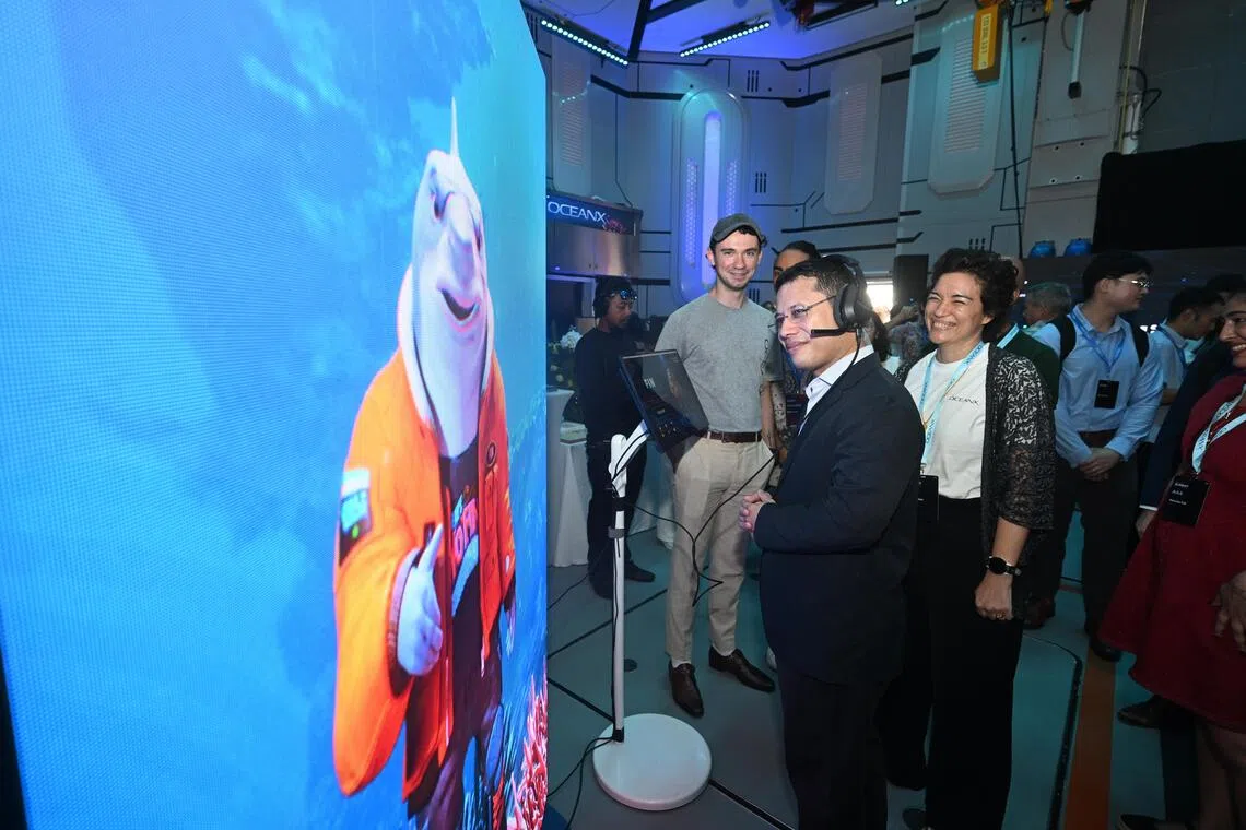 Education Minister Desmond Lee touring the exhibition inside the OceanXplorer vessel on the third day of the OceanX Summit on Oct 9, 2026. ST PHOTO: AZMI ATHNI