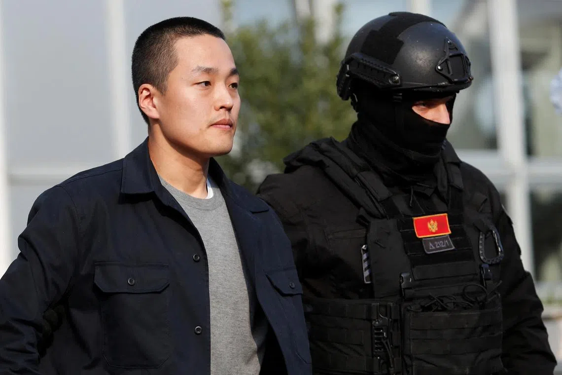 FILE PHOTO: A police officer escorts Terraform Labs co-founder Do Kwon after he served a sentence for document forgery in Podgorica, Montenegro, March 23, 2024. REUTERS/Stevo Vasiljevic/File Photo