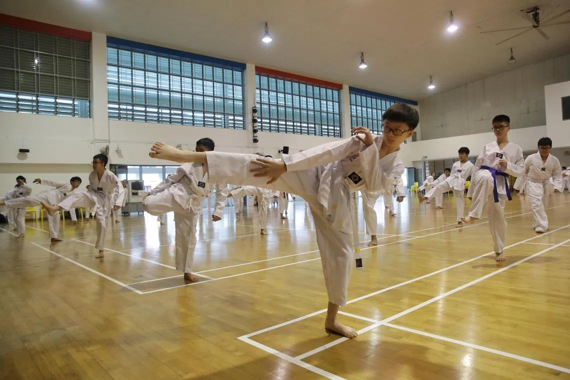 ST20230517_202323874730 : Gin Tay/ amedgefield21/Amelia Teng/
Feature story for Smart Parenting's School Spotlight series:
Secondary one students attending Edgefield Secondary’s Learning for Life Programme (LLP) - Taekwondo in the school hall on May 17, 2023.
