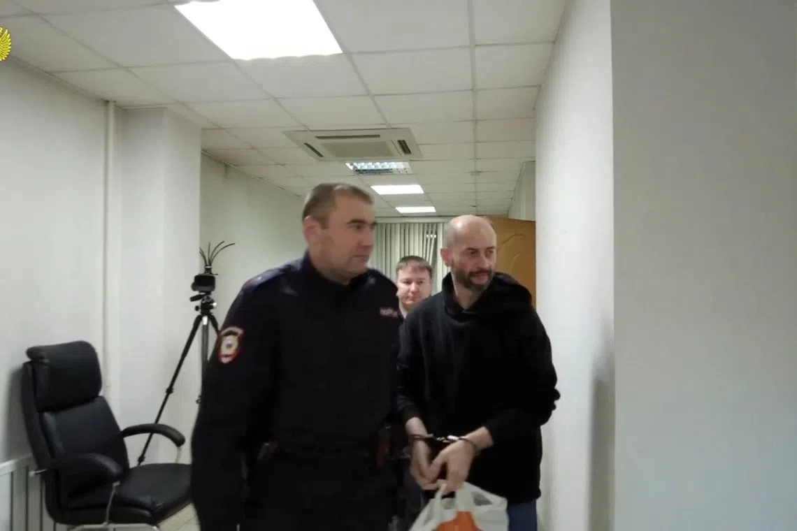 Belarusian citizen Sergei Yeremeyev, who is accused of carrying out an act of terrorism and of planting explosives on two freight trains in Russia's Buryatia region on the orders of Ukraine's intelligence services in 2023, attends a court hearing in Chita, Russia, in this still image from video released December 18, 2025. Russian Prosecutor General's Office/Handout via REUTERS