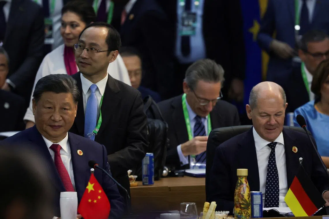 FILE PHOTO: China's President Xi Jinping and German Chancellor Olaf Scholz attend the G20 summit at the Museum of Modern Art in Rio de Janeiro, Brazil, November 18, 2024. REUTERS/Ricardo Moraes/File Photo