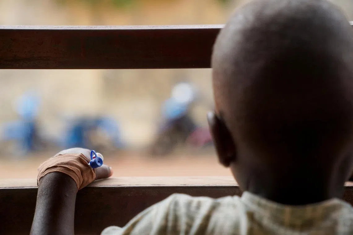 FILE PHOTO: A child living with HIV, wearing an intravenous (IV) cannula in the hand, looks on, at the Federal Medical Centre in Makurdi, Benue State, Nigeria, February 11, 2026. REUTERS/Marvellous Durowaiye/File Photo