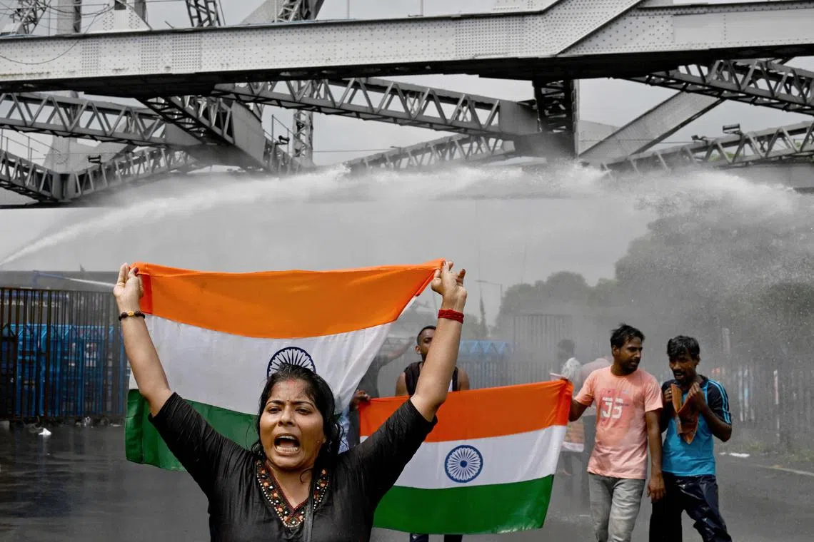 Police fired tear-gas and water cannon to disperse protesters marching towards the state secretariat on Aug 27, 2024.