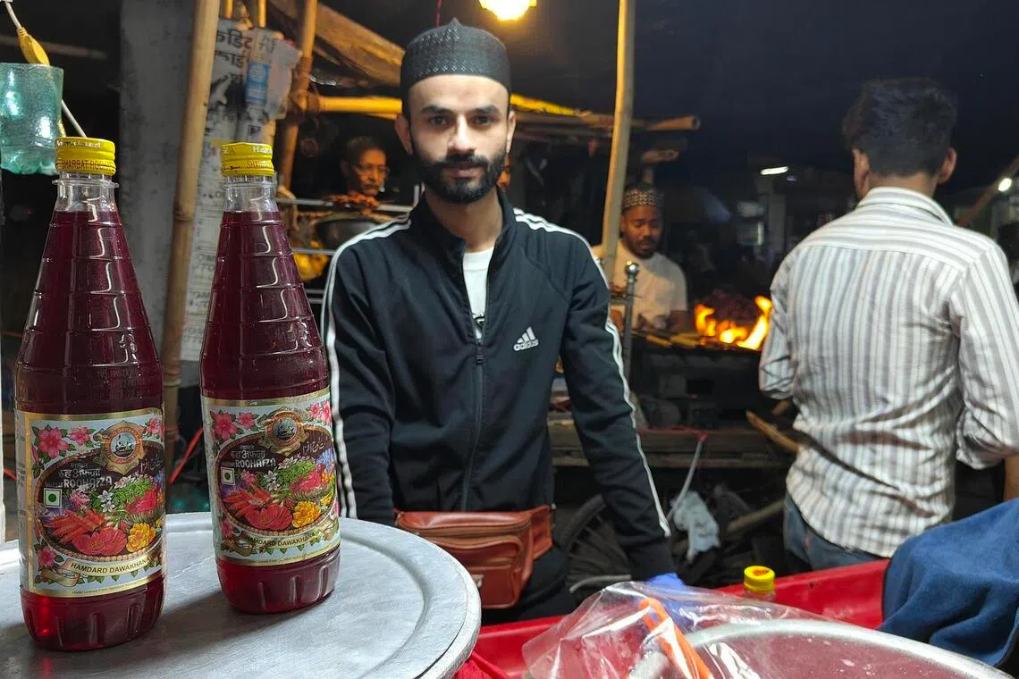 Mr Mohammad Shadab, 24, at his cart in Delhi’s Batla House neighbourhood that retails drinks made with Roohafza, a popular rose-flavoured concentrate in India, on March 19.