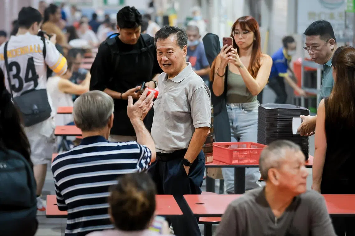Presidential candidate Tan Kin Lian greeting patrons and stall vendors at ABC Brickworks Market and Food Centre on Aug 23, 2023.