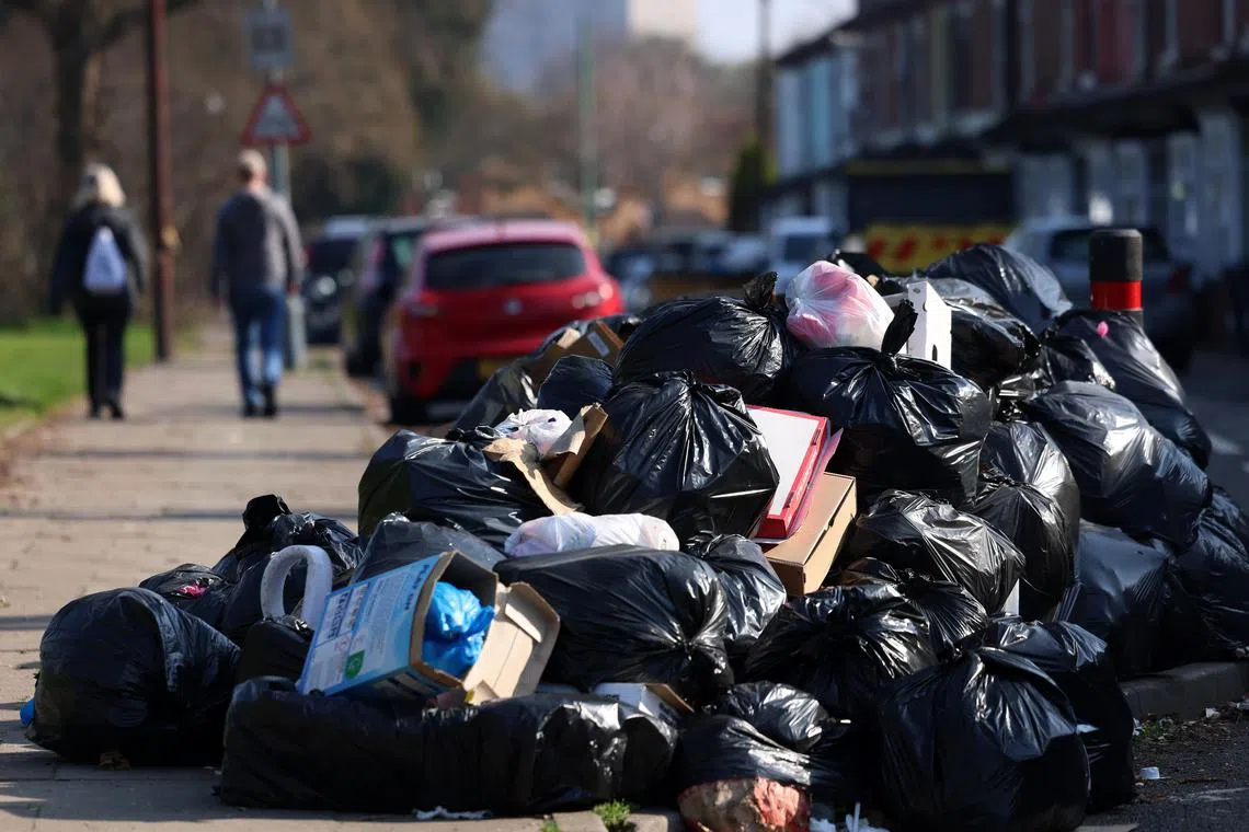 Rubbish is piled high on residential streets across the Birmingham as refuse collectors are striking over pay and working conditions. 