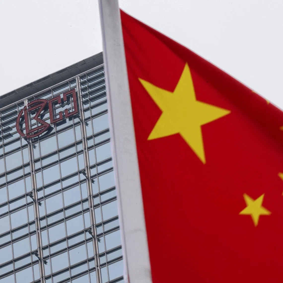 A Chinese national flag flutters in the wind with the Cheung Kong Center building and CK Hutchison logo in the background in Hong Kong, China, April 1, 2025. REUTERS/Tyrone Siu