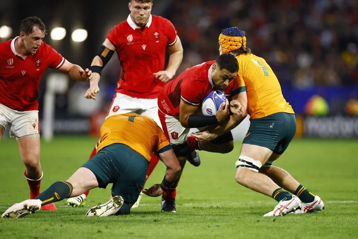 Rugby Union - Rugby World Cup 2023 - Pool C - Wales v Australia - OL Stadium, Lyon, France - September 24, 2023 Wales' Taulupe Faletau in action with Australia's Tom Hooper REUTERS/Sarah Meyssonnier