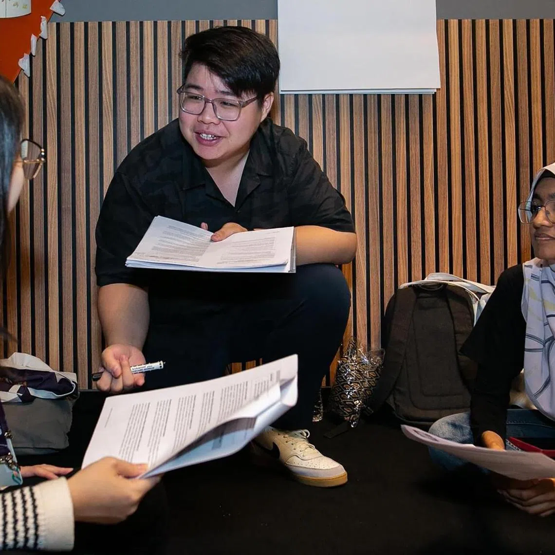 Mr Jalen Goh (centre) was one of the facilitators at the YLCha3 Dialogue Event., teaching students how to chat effectively.  

PHOTO: COURTESY OF ROSES OF PEACE