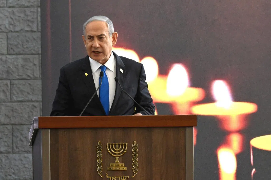 Israeli Prime Minister Benjamin Netanyahu speaks at a memorial ceremony for those murdered by Hamas on October 7, 2023, and those who fell in the \"Iron Sword\" war, at the Knesset, the Parliament, in Jerusalem, on Monday, October 28, 2024. DEBBIE HILL/Pool via REUTERS