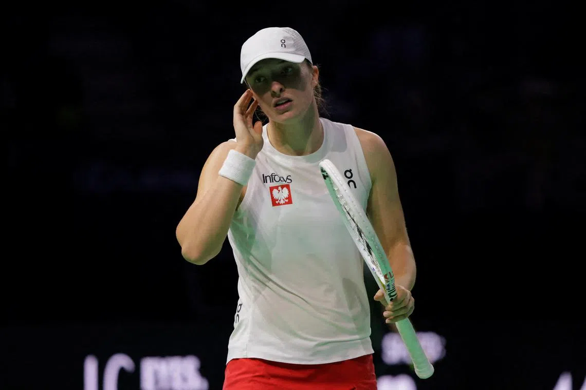 FILE PHOTO: Tennis - Billie Jean King Cup Finals - Semi Final - Poland v Italy - Palacio de Deportes Jose Maria Martin Carpena Arena, Malaga, Spain - November 18, 2024 Poland's Iga Swiatek reacts during her match against Italy's Jasmine Paolini REUTERS/Jon Nazca/File Photo