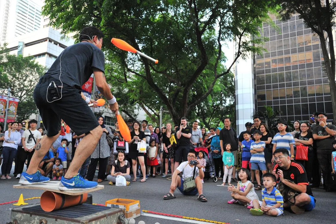A busker performing in Orchard Road in February 2016.