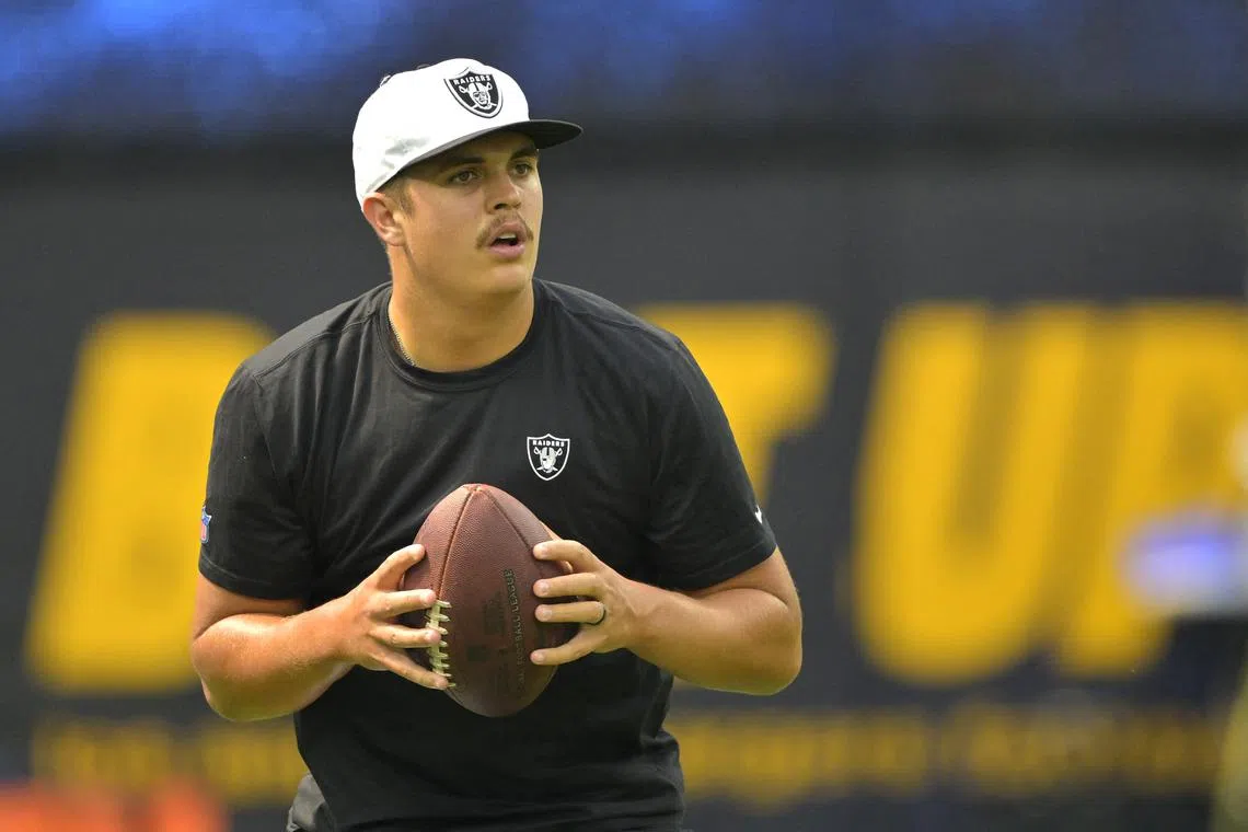 FILE PHOTO: Sep 8, 2024; Inglewood, California, USA; Las Vegas Raiders quarterback Aidan O'Connell (12) warms up prior to the game against the Los Angeles Chargers at SoFi Stadium. Mandatory Credit: Jayne Kamin-Oncea-Imagn Images/File Photo
