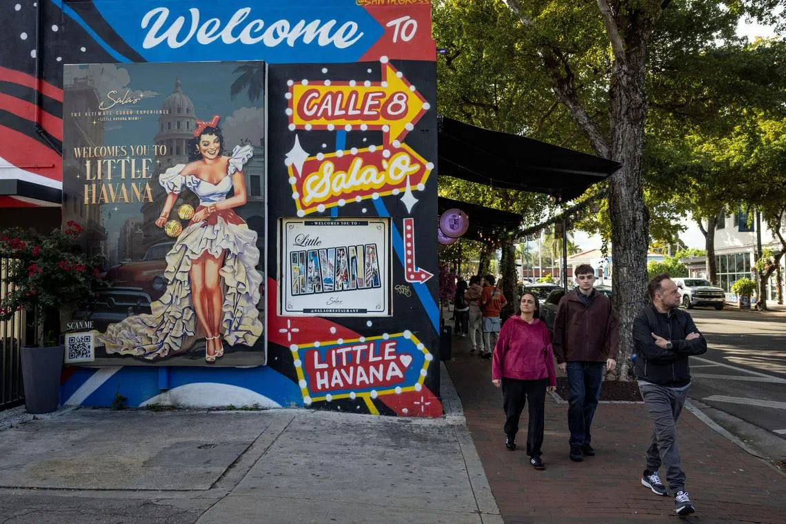 People walk past mural along Calle Ocho in the Little Havana neighborhood in Miami, Florida, U.S., February 3, 2026.