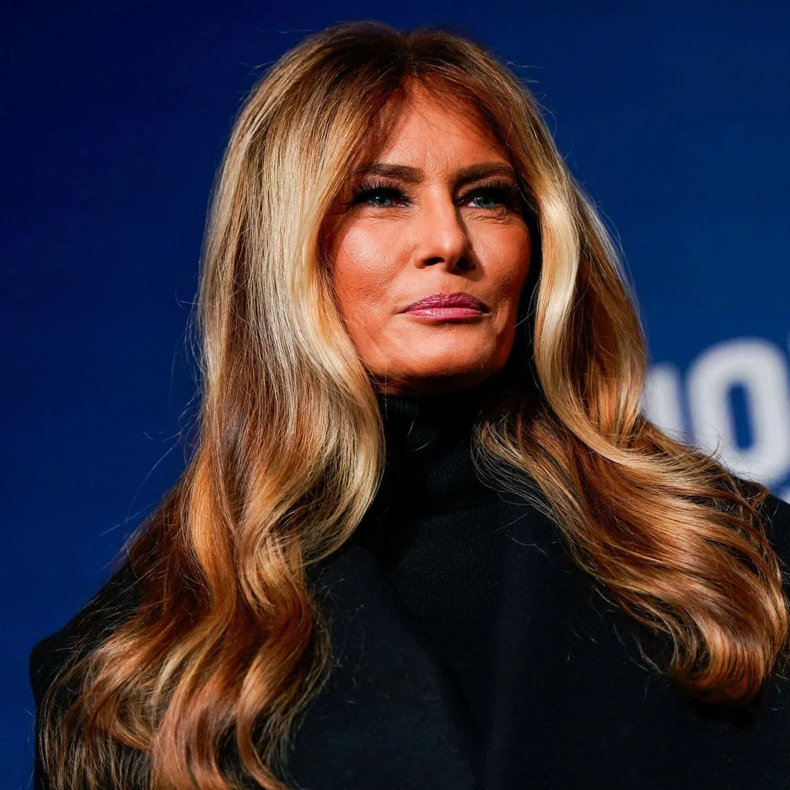 U.S. first lady Melania Trump stands next to her 2025 inaugural gown in the Flag Hall of the Smithsonian's National Museum of American History in Washington, D.C., U.S., February 20, 2026. REUTERS/Elizabeth Frantz