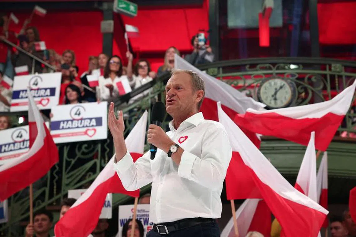 FILE PHOTO: Donald Tusk, the leader of the largest opposition grouping Civic Coalition (KO), speaks at the meeting with women during election convention in Lodz, Poland, October 10, 2023. REUTERS/Kacper Pempel/File Photo
