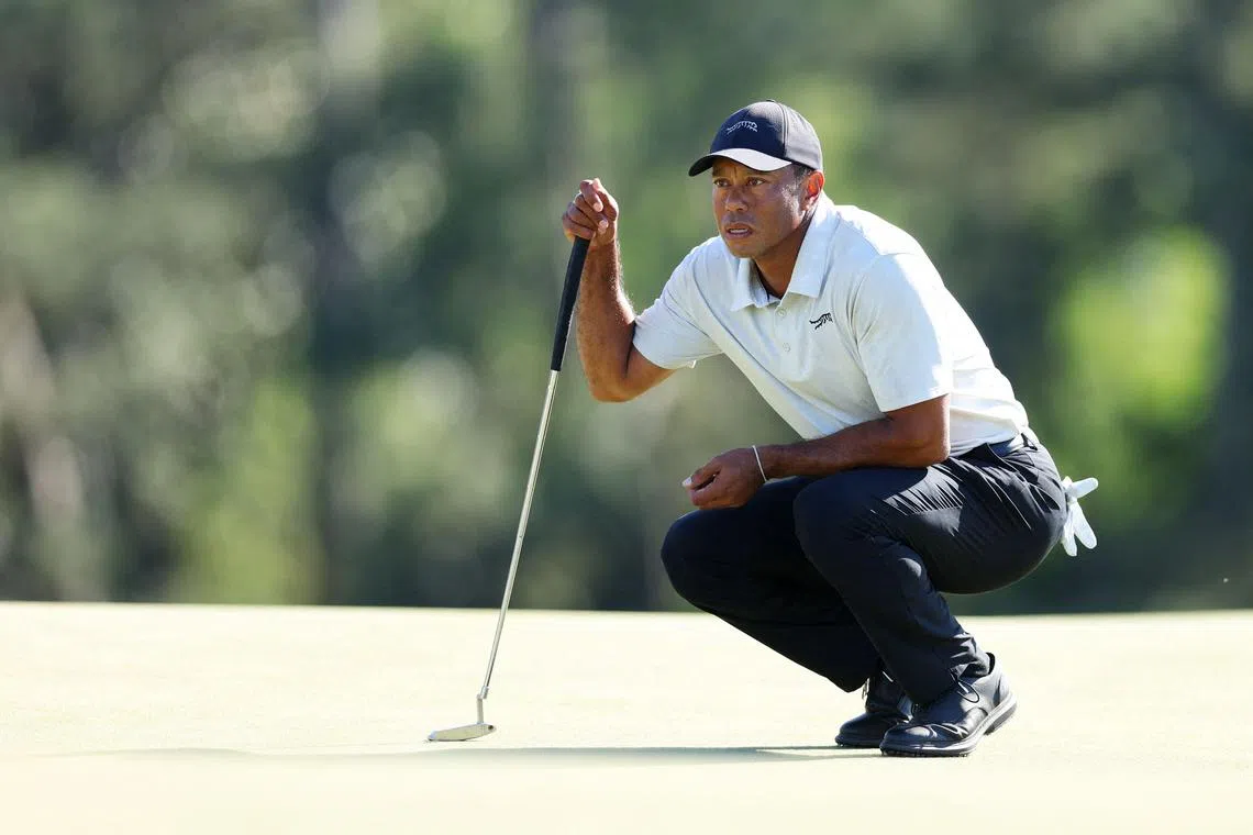 Tiger Woods of the United States lining up a putt on the 18th green during the third round of the 2024 Masters Tournament at Augusta National Golf Club on April 13 in Augusta, Georgia.  The 15-time Major champion carded a 10-over 82 on April 13, his worst-ever score at Augusta National. 