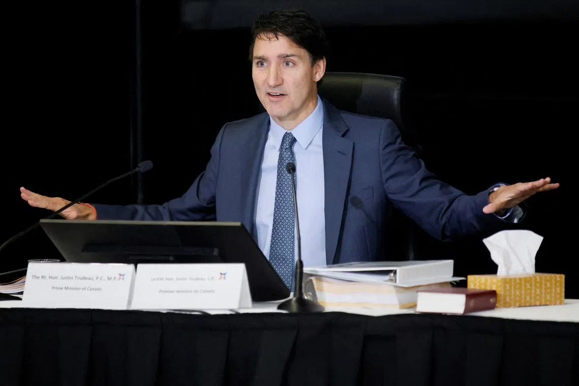 FILE PHOTO: Canada's Prime Minister Justin Trudeau takes part in public hearings for an independent commission probing alleged foreign interference in Canadian elections in Ottawa, Ontario, Canada October 16, 2024. REUTERS/Blair Gable/File Photo