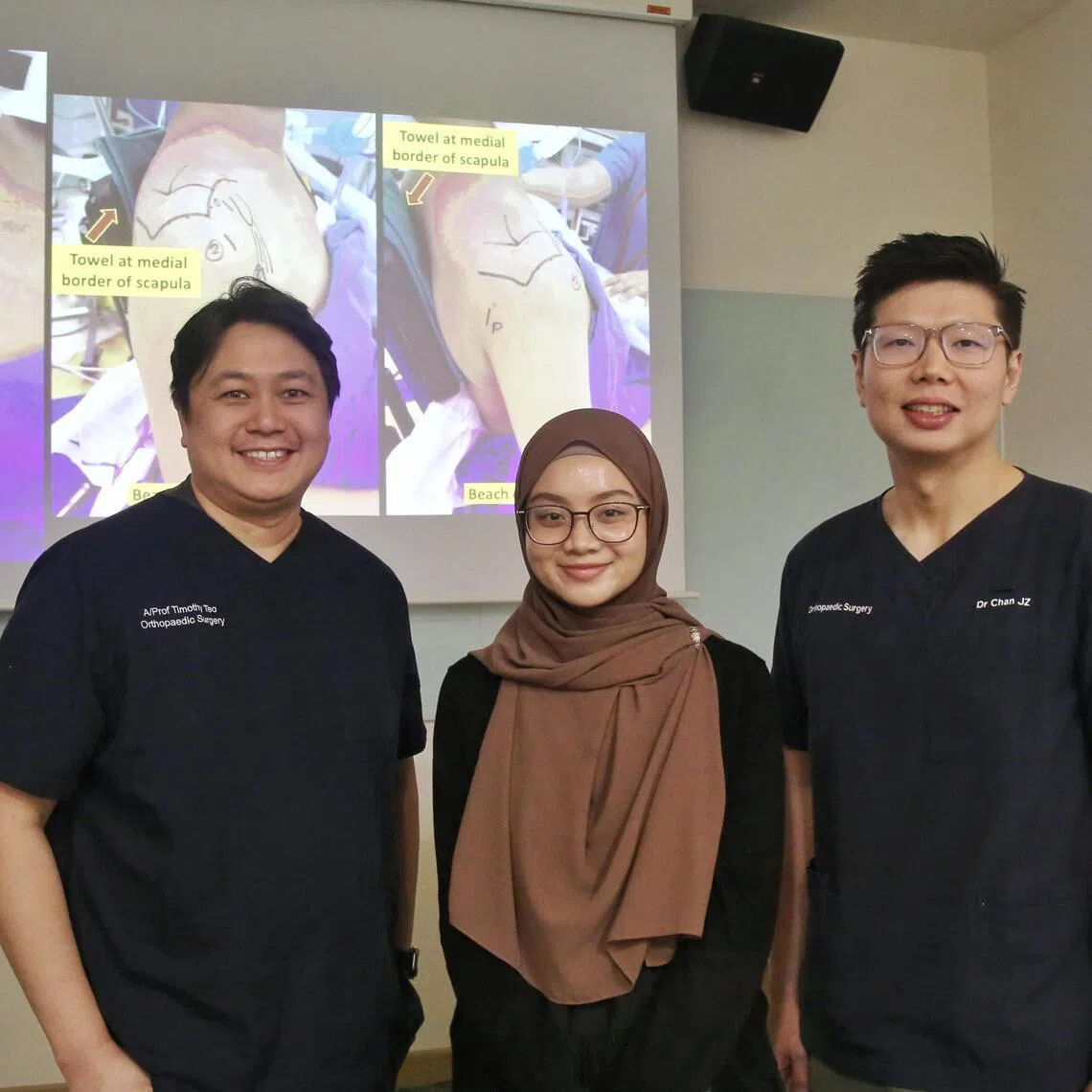 Preschool teacher Yusmarni Mohammad Hasni (centre), the first patient in Singapore to undergo the surgery, with KTPH’s head of department of orthopaedic surgery Timothy Teo Wei Wen (left) and consultant surgeon Chan Juen Zhik from KTPH’s shoulder, elbow and sports surgery service.