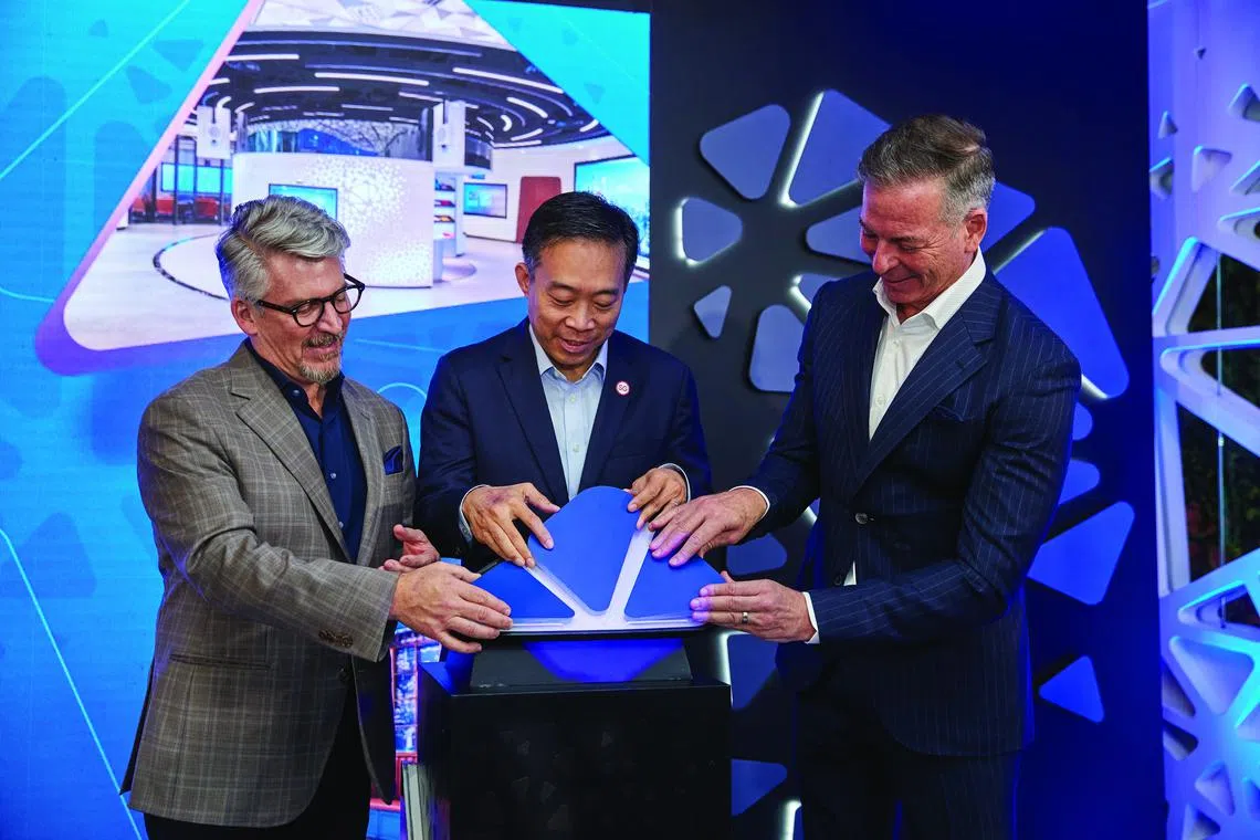 From left: Jack Forestell, Visa’s Chief Product & Strategy Officer; Png Cheong Boon, Chairman, Singapore Economic Development Board; and Stephen Karpin, Regional President for Visa Asia Pacific at the grand reopening of Visa’s Innovation Centre in Singapore. PHOTO: VISA