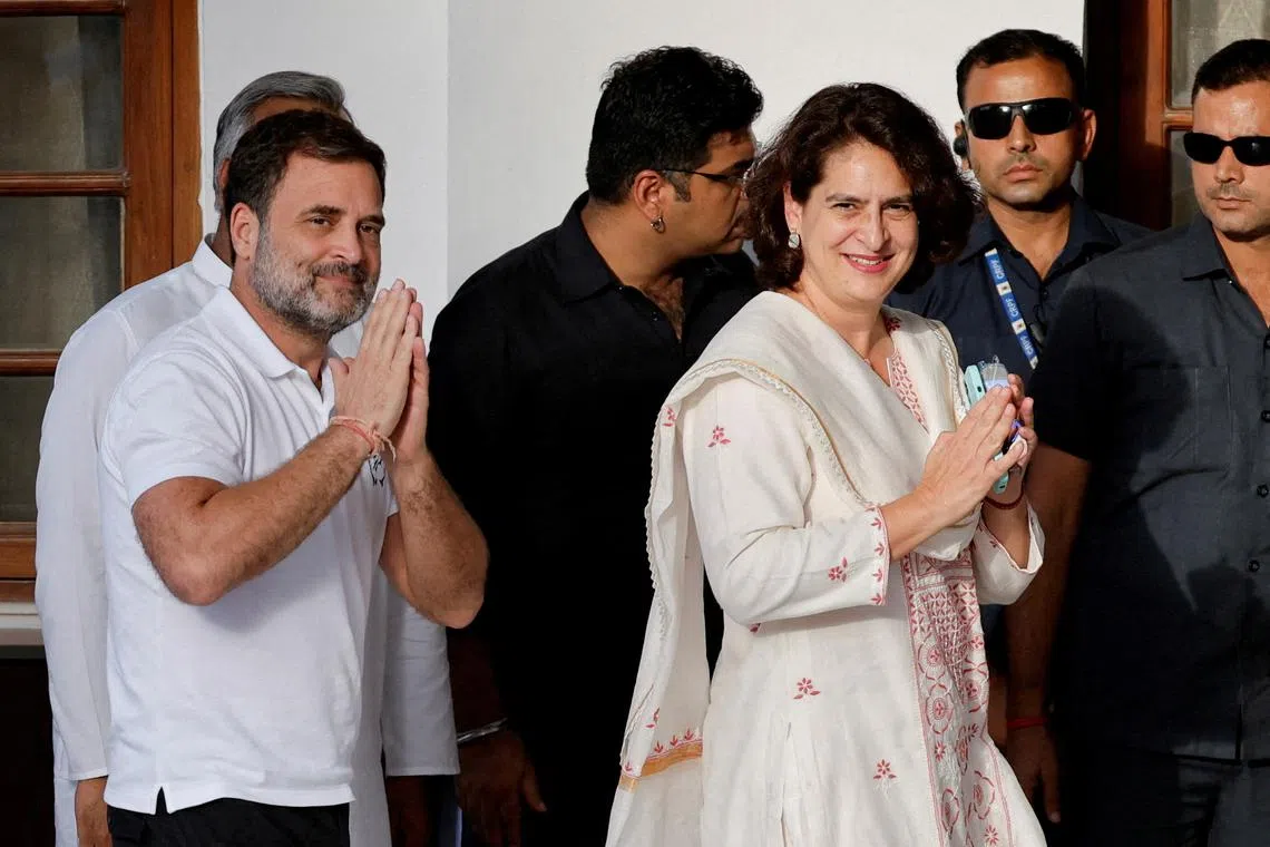 FILE PHOTO: Rahul Gandhi, senior leader of India's main opposition Congress Party, and his sister Priyanka Gandhi Vadra gesture on the day of the Indian National Developmental Inclusive Alliance (INDIA) bloc's meeting in New Delhi, India, June 5, 2024. REUTERS/Adnan Abidi/File Photo
