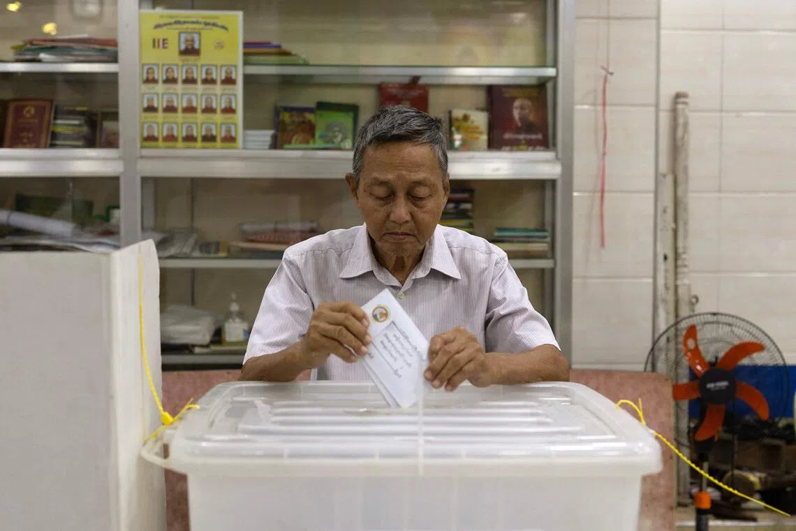 A man taking part in early voting in Yangon on Dec 26 ahead of the start of Myanmar's general election.