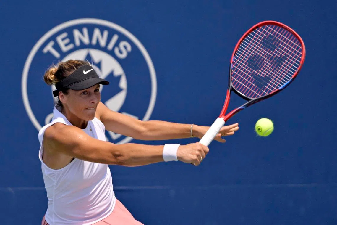 Jul 28, 2025; Montreal, QC, Canada; Tatjana Maria (GER) reacts returns the ball against Laura Siegemund (GER) in first round play at IGA Stadium. Mandatory Credit: Eric Bolte-Imagn Images