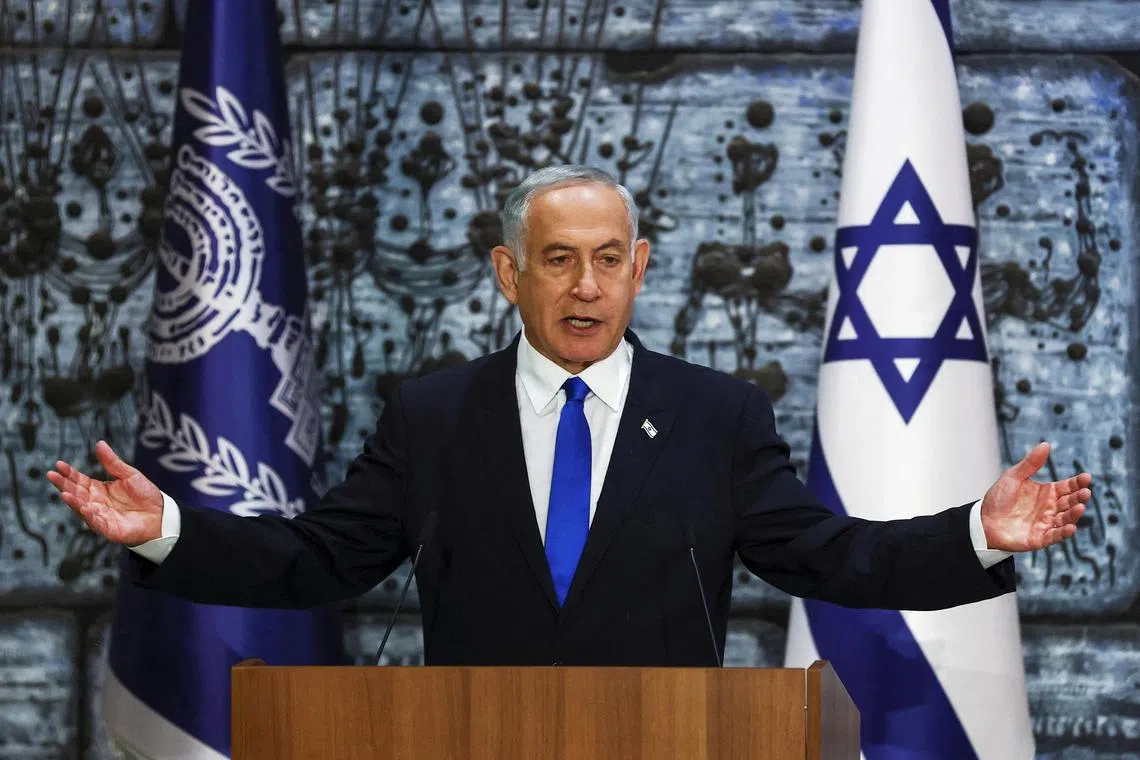 FILE PHOTO: Benjamin Netanyahu speaks during a ceremony where Israel President Isaac Herzog hands him the mandate to form a new government following the victory of the former premier's right-wing alliance in this month's election at the President's residency in Jerusalem November 13, 2022. REUTERS/ Ronen Zvulun/File Photo