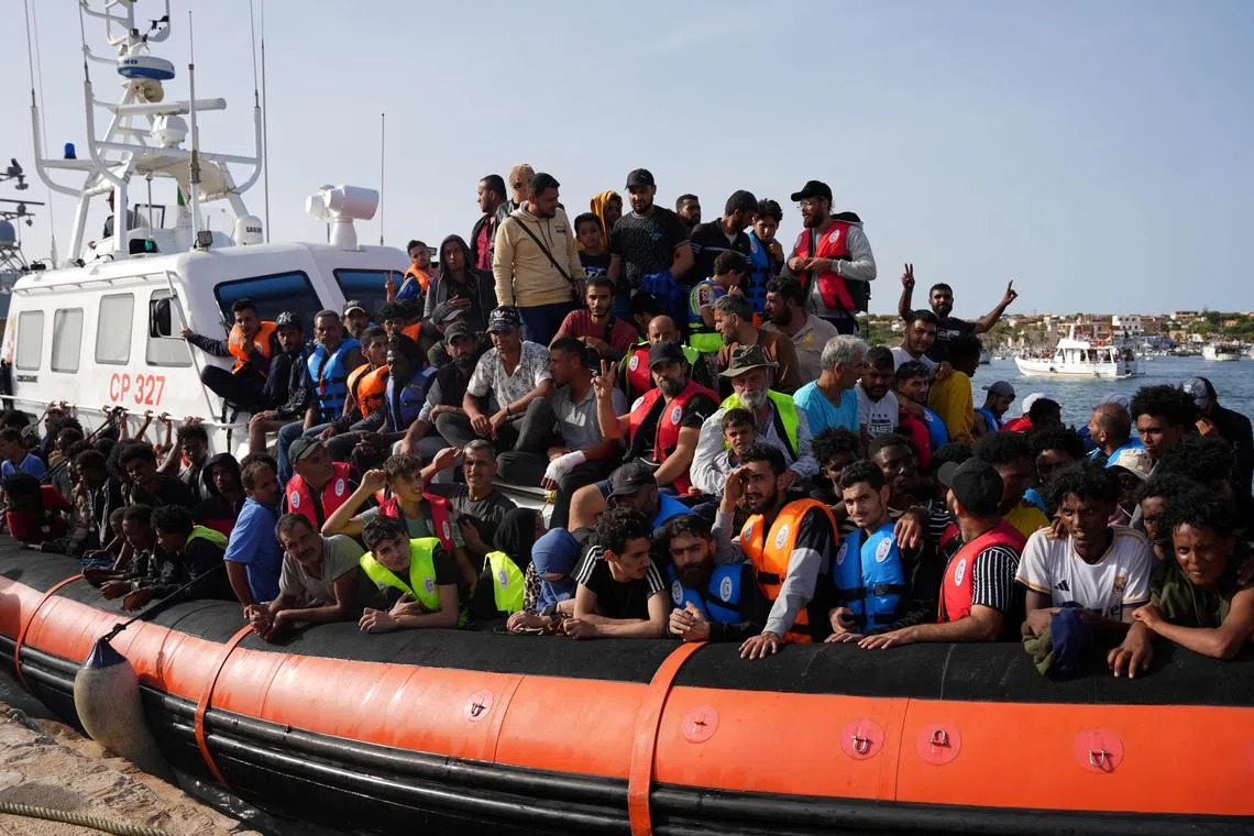 Migrants arriving at Lampedusa's harbour  on Sept 18, 2023. 
