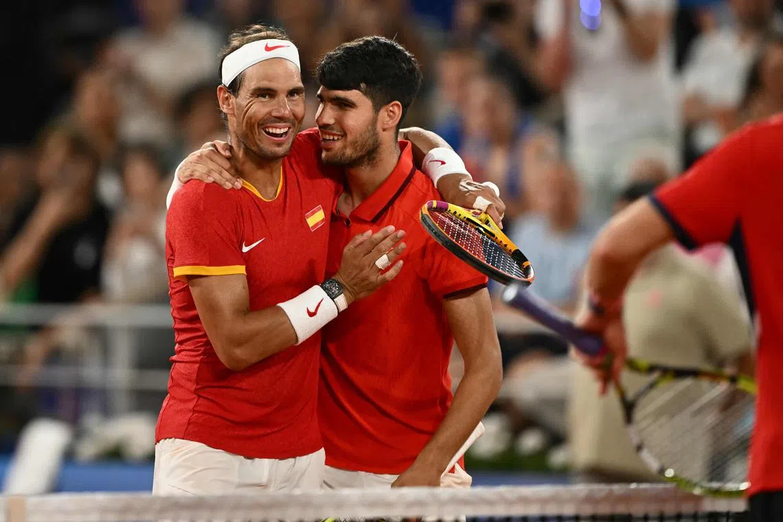 Spain's Rafael Nadal (left) embracing Carlos Alcaraz after losing to the United States' Austin Krajicek and Rajeev Ram in their men's doubles quarter-finals at the Paris Olympics in July.