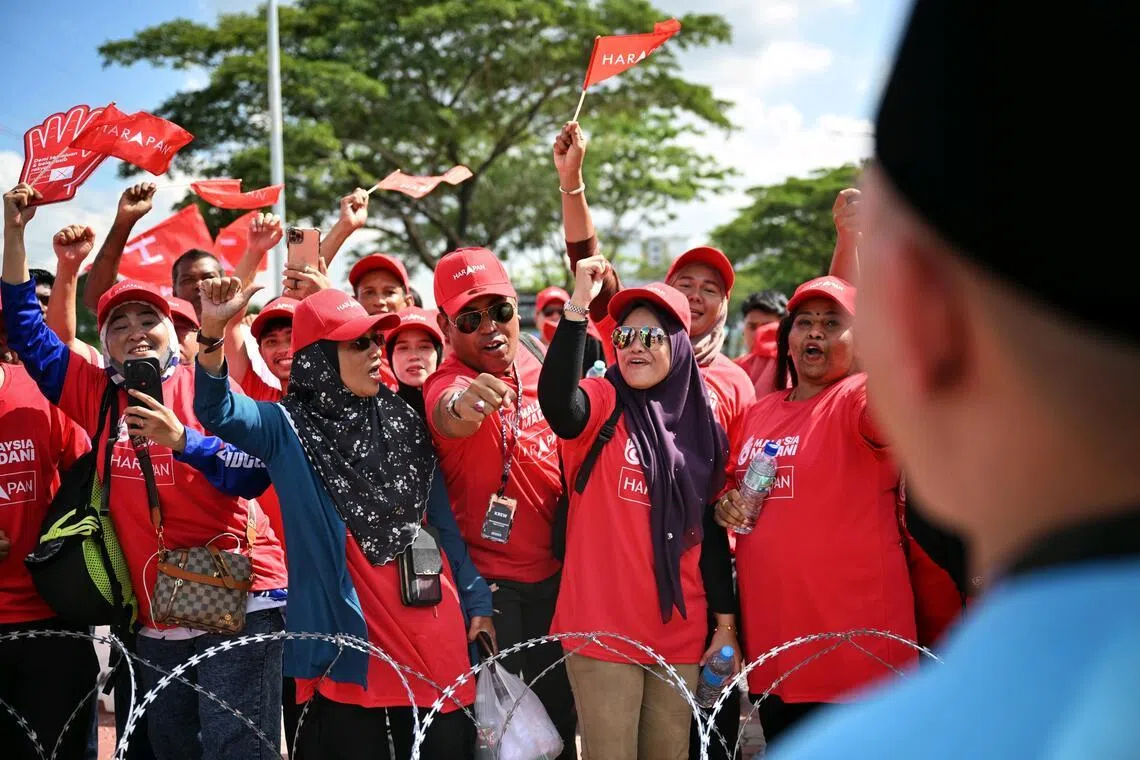 Pakatan Harapan supporters outside the nomination centre on June 27.