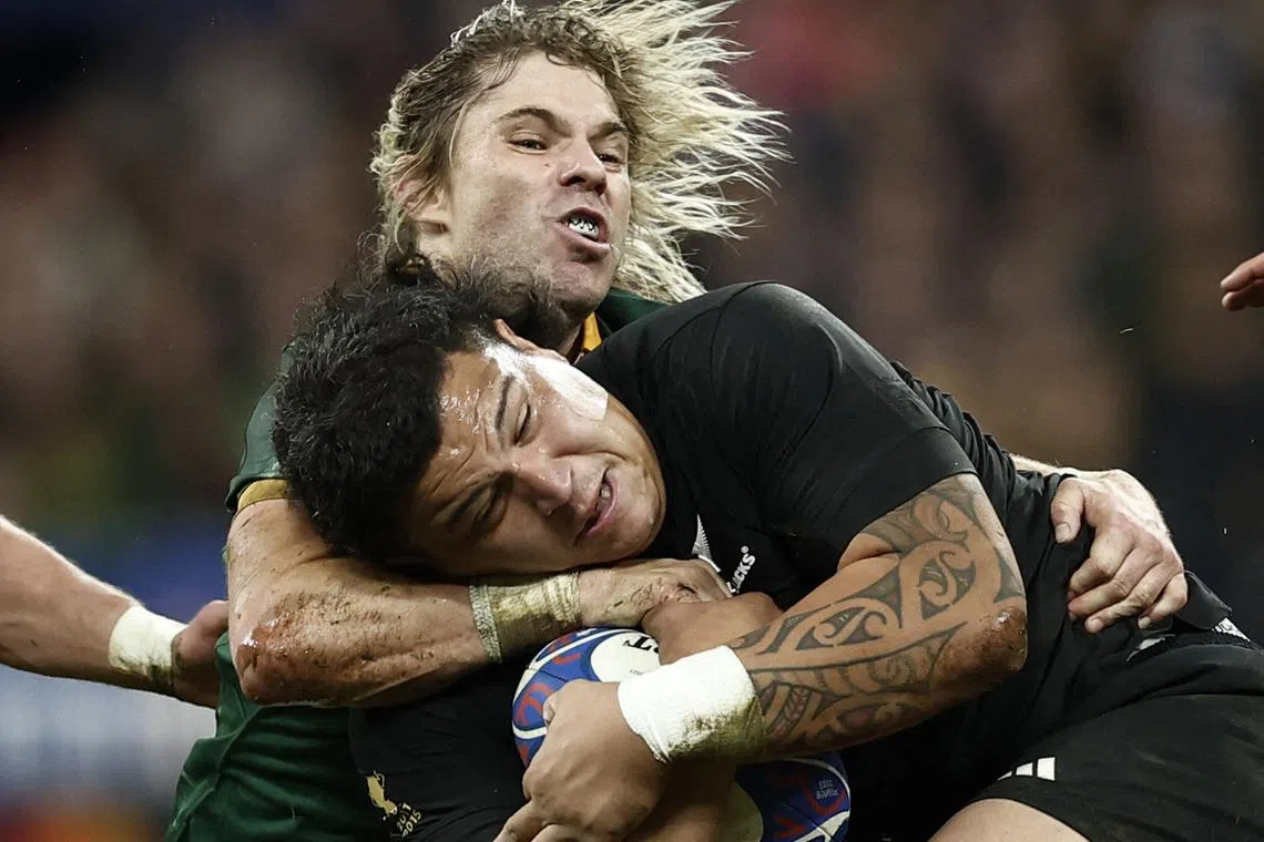 FILE PHOTO: Rugby Union - Rugby World Cup 2023 - Final - New Zealand v South Africa - Stade de France, Saint-Denis, France - October 28, 2023 New Zealand's Samisoni Taukei'aho in action with South Africa's Faf de Klerk REUTERS/Benoit Tessier/File photo