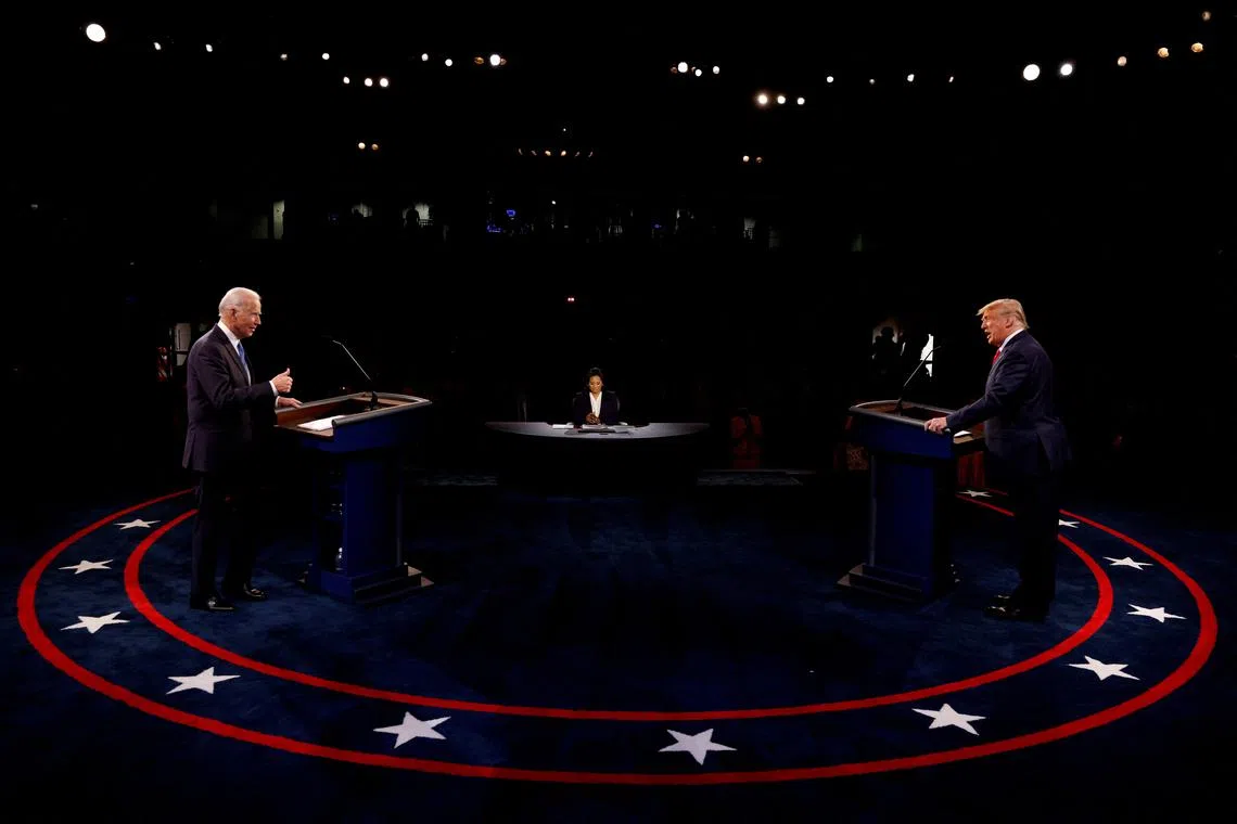 FILE PHOTO: Democratic presidential nominee Joe Biden gestures towards U.S. President Donald Trump as they participate in their second 2020 presidential campaign debate at Belmont University in Nashville, Tennessee, U.S., October 22, 2020. REUTERS/Jim Bourg/Pool/File Photo