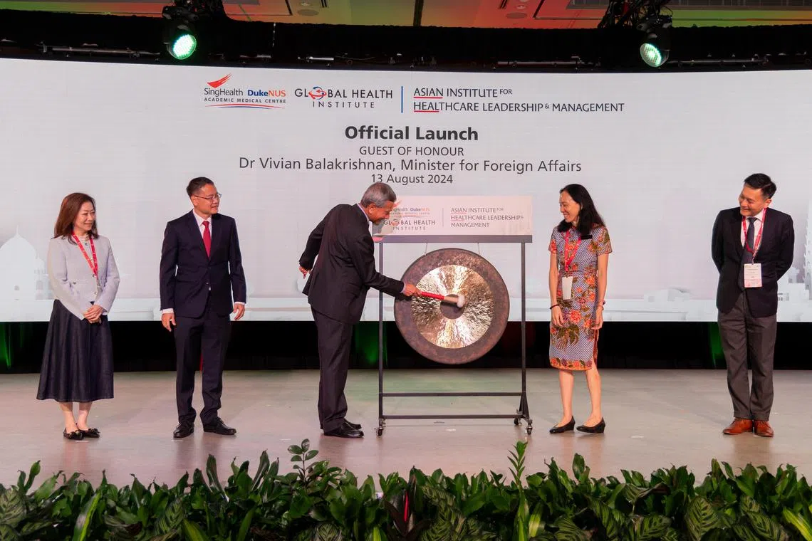 Asian HEAL was launched by Foreign Minister Vivian Balakhrishnan at the Singapore Healthcare Management conference. Looking on (left to right): Ms Karen Chang, Senior Vice Dean and Group Director of the Office of Corporate Services; Professor Ng Wai Hoe, Group Chief Executive Officer ＆ Senior Consultant, National Neuroscience Institute; Professor Ong Biauw Chi, Senior Consultant, Sengkang General Hospital; and Professor Tan Hiang Khoon, Senior Consultant & Deputy CEO (Future Health System), SGH  National Cancer Centre Singapore