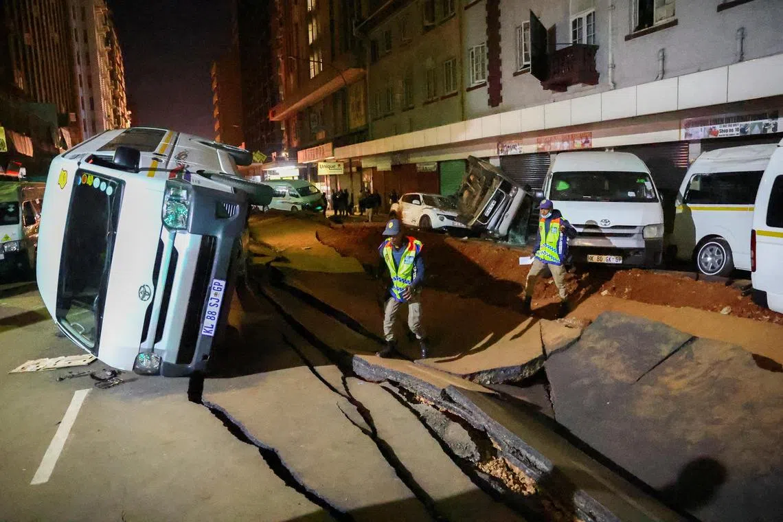 The unexplained blast tore through a main road, cracking tarmac and overturning vehicles.