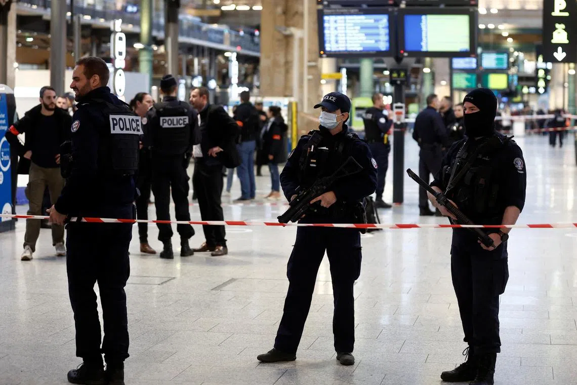 French police secure the area after a man with a knife wounded several people at the Gare du Nord train station on Jan 11. 