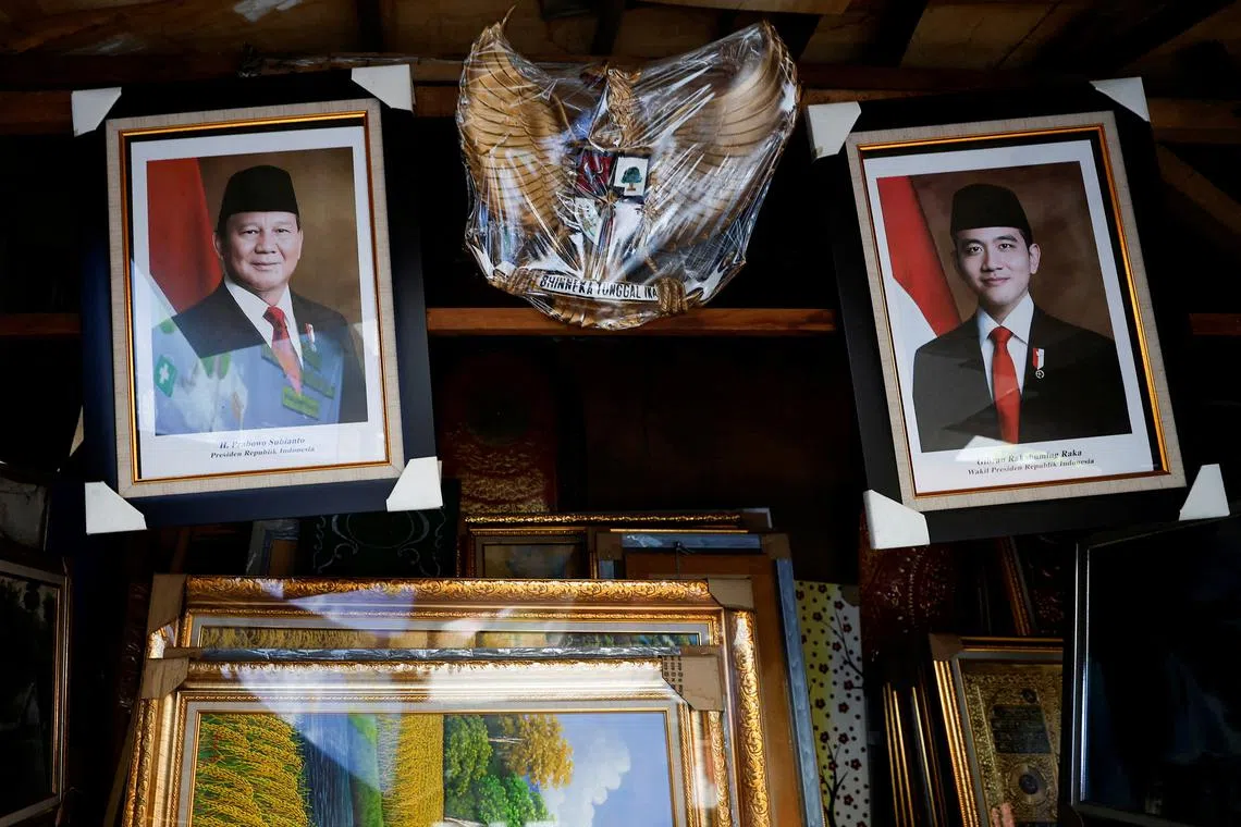 Pictures of Indonesian President-elect Prabowo Subianto and Vice President-elect Gibran Rakabuming Raka, the son of outgoing President Joko \"Jokowi\" Widodo, hang at a stall, ahead of their inauguration, in Jakarta, Indonesia, October 18, 2024. REUTERS/Willy Kurniawan