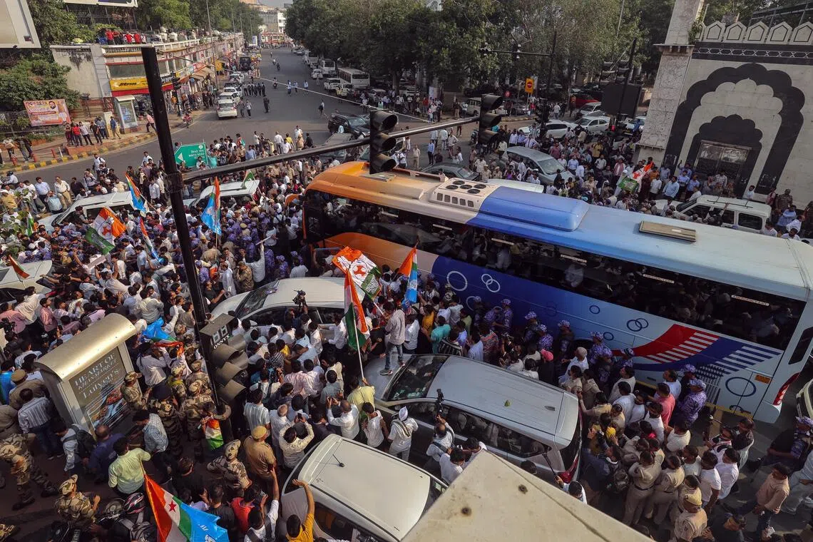 Indian National Developmental Inclusive Alliance bloc members of parliament and their supporters take part in a protest march demanding the resignation of Chief Election Commissioner Gyanesh Kumar in New Delhi on Oct 8.