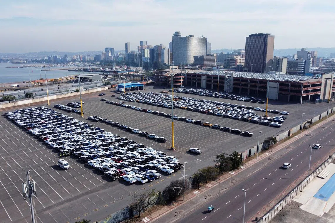 FILE PHOTO: A drone view of cars, ready to be loaded onto a ship, at the car terminal in port in Durban, South Africa, July 9, 2025. REUTERS/Rogan Ward/File Photo