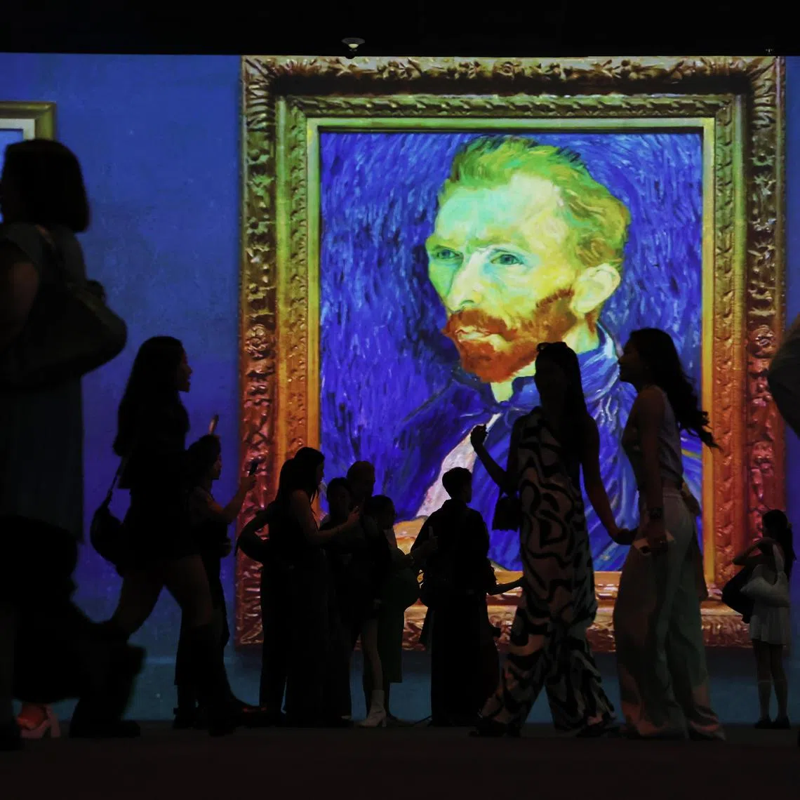ST20250123_202528200137/pixdigitalart/Brian Teo/Invited guests exploring the Van Gogh INSIDE: Love, Vincent digital art exhibition during the preview at Parkview Square on Jan 23, 2025. It is one of two new immersive experiences, with the other being Gustav Klimt: Timeless Beauty, unveiled by GROUNDSEESAW, a digital art exhibition brand by Seoul-based Media & Art Co., Ltd. Set across five screens—each over six meters high—the theatrical experience is designed to immerse guests in the colourful worlds of these iconic artists. Alongside the existing Monet Inside exhibition, the digital art displays will rotate daily. ST PHOTO: BRIAN TEO 