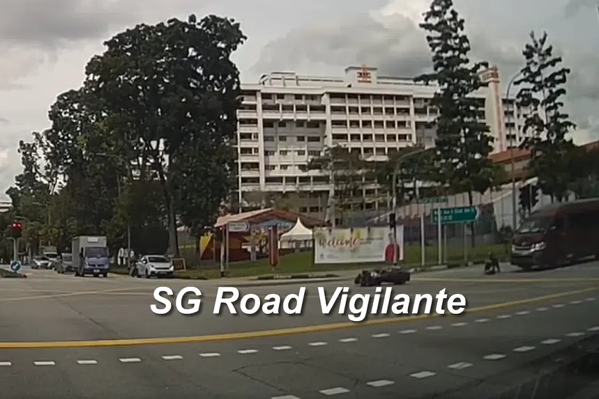 The motorcyclist was momentarily flung into the air before falling off her motorcycle. 