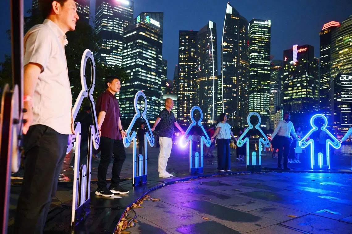 National Development Minister Chee Hong Tat (second from left) invited the public to view the Draft Master Plan 2025 exhibition when it launches on June 25.