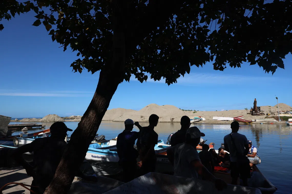 People arriving from their day of fishing in La Guaira, Venezuela, Dec 3, 2025, amid tensions between Venezuala and the US over the US naval deployment in the Caribbean Sea, ordered by US President Donald Trump. 