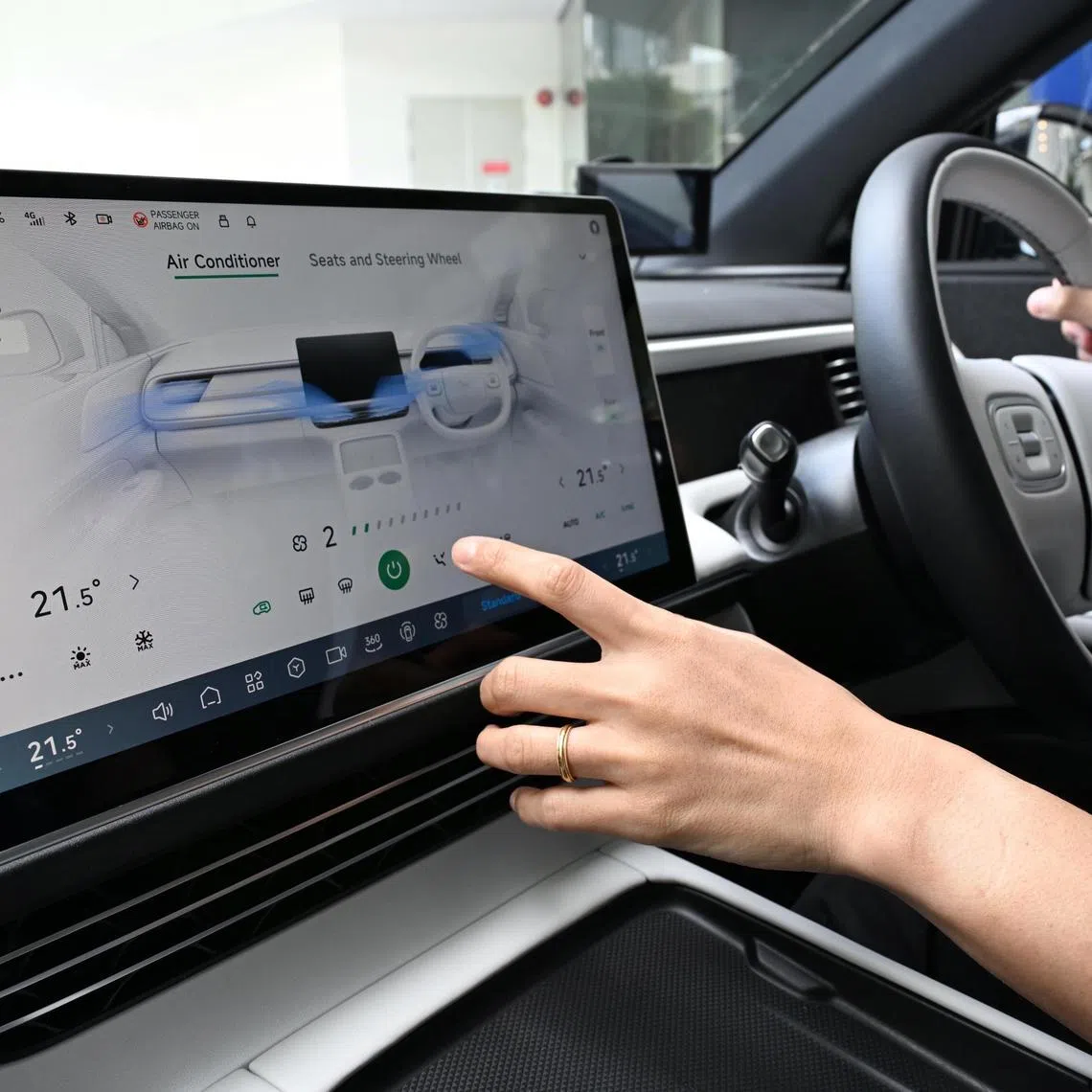 Generic photo of a driver adjusting the airconditioning in the electric car Xpeng G6 taken on Feb 10, 2025.