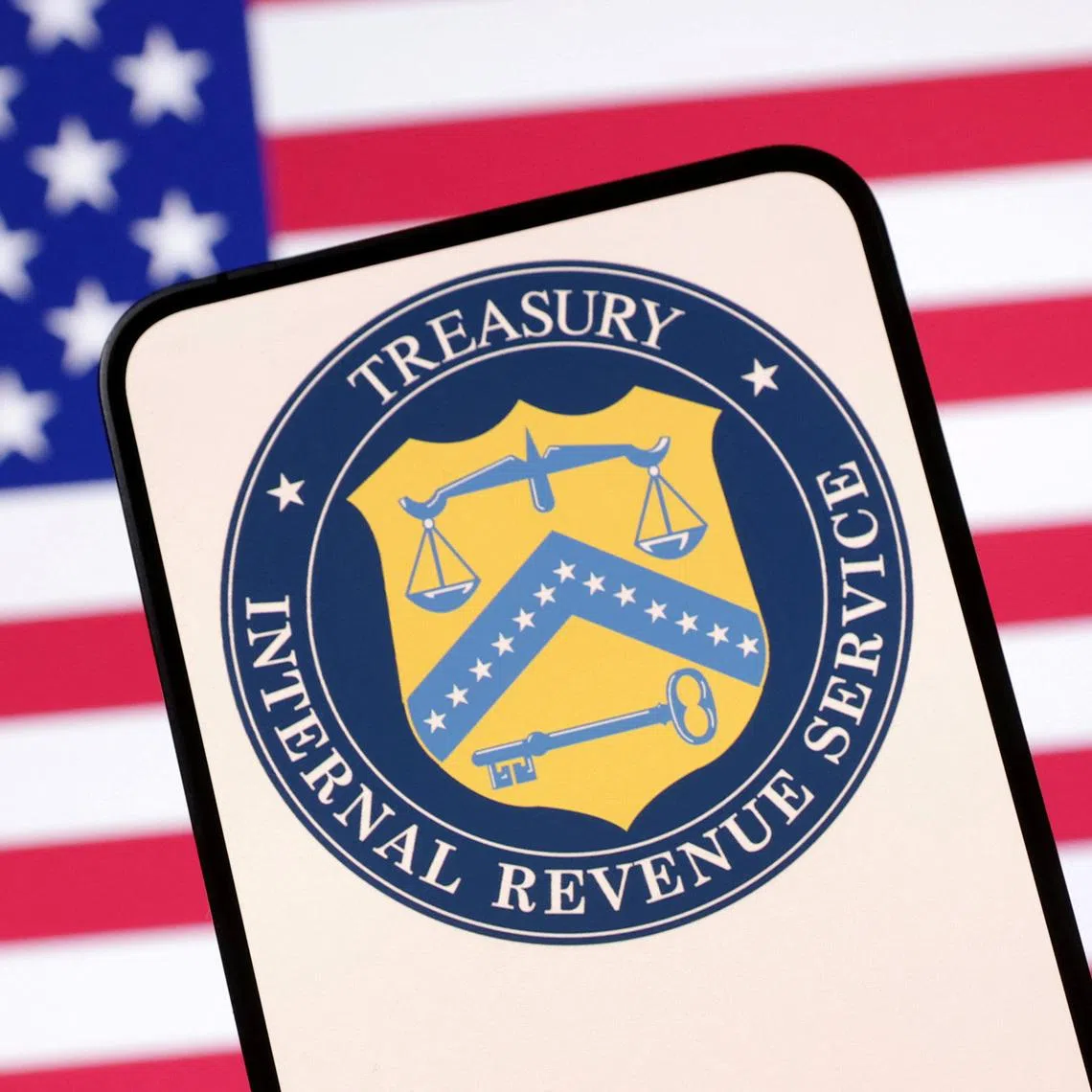 United States Department of the Treasury logo and U.S. flag are seen in this illustration taken April 23, 2025. REUTERS/Dado Ruvic/Illustration