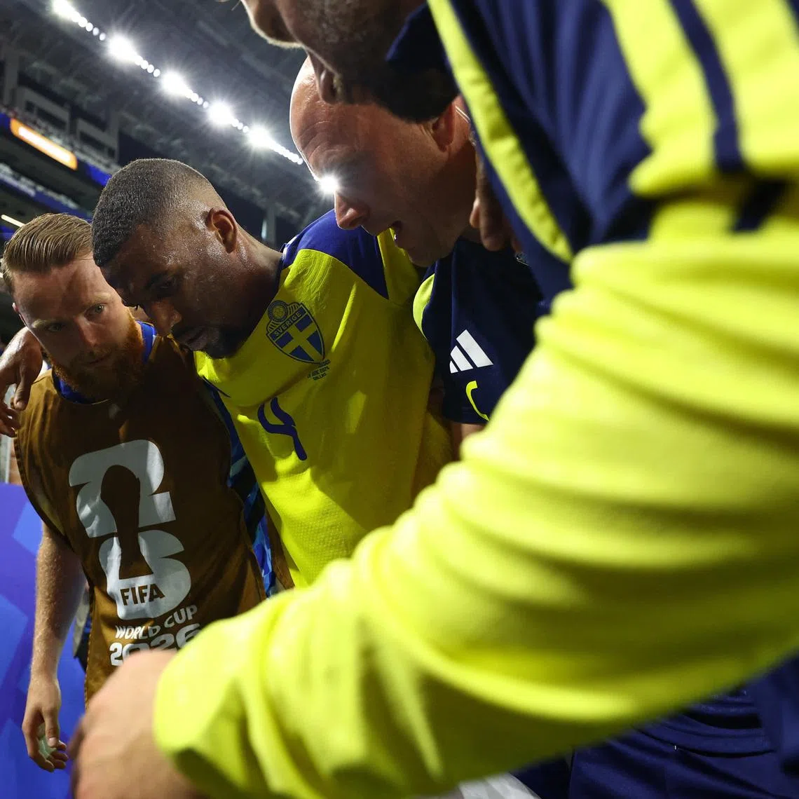 Soccer Football - FIFA World Cup 2026 - Group F - Japan v Sweden - Dallas Stadium, Arlington, Texas, U.S. - June 25, 2026 Sweden's Isak Hien receives medical attention after sustaining an injury REUTERS/Hannah Mckay