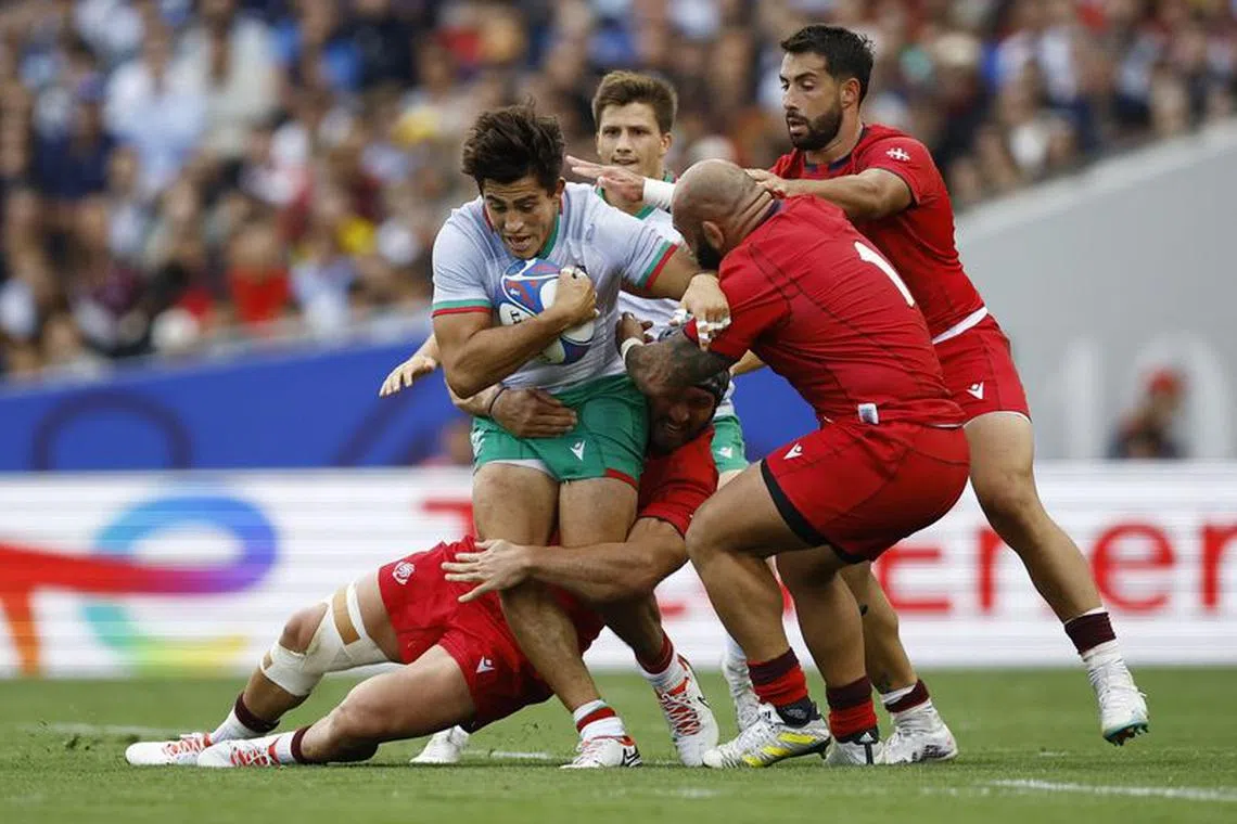 Rugby Union - Rugby World Cup 2023 - Pool C - Georgia v Portugal - Stadium Municipal de Toulouse, Toulouse, France - September 23, 2023  Portugal's Tomas Appleton in action with Georgia's Nika Abuladze REUTERS/Stephane Mahe