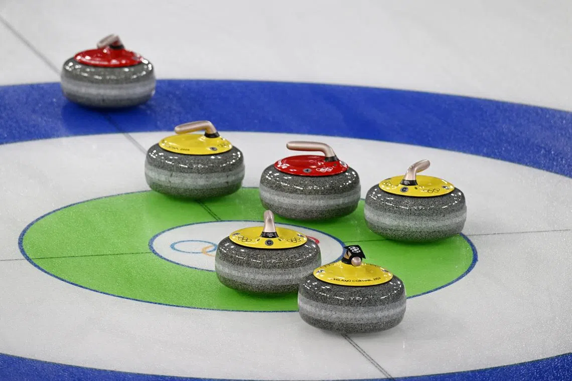 Milano Cortina 2026 Olympics - Curling - Mixed Doubles Round Robin Session 8 - Sweden vs Italy - Cortina Curling Olympic Stadium, Cortina d'Ampezzo, Italy - February 07, 2026. Curling stones sit on the ice during a match of Amos Mosaner of Italy and Stefania Constantini of Italy against Isabella Wranaa of Sweden and Rasmus Wranaa of Sweden REUTERS/Jennifer Lorenzini