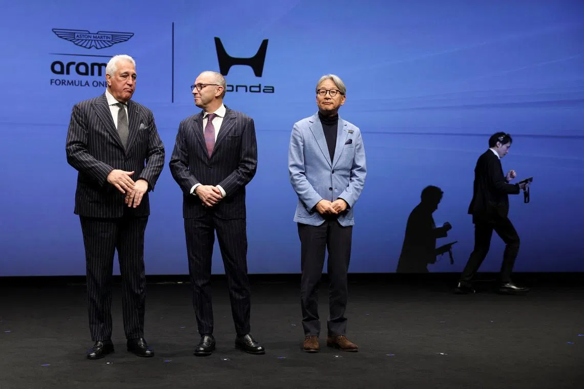 Aston Martin Aramco Formula One Team Executive Chairman Lawrence Stroll, Formula One Group President and F1 CEO Stefano Domenicali and Honda CEO Toshihiro Mibe prepare for a photo session during their joint press conference on their partnership launch announcement in Tokyo, Japan, January 20, 2026.   REUTERS/Issei Kato